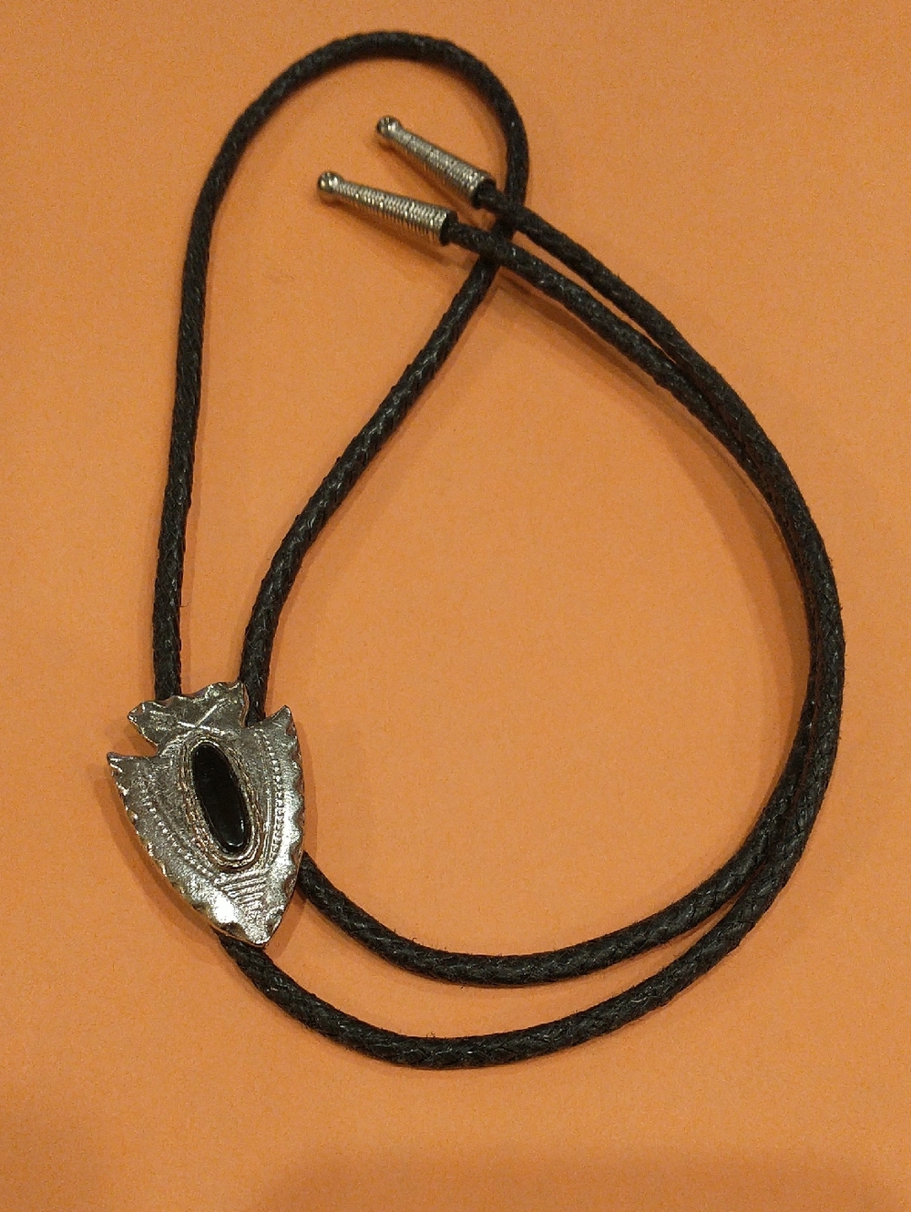 Unisex Silver Arrowhead Bolo Tie with Black Cord
